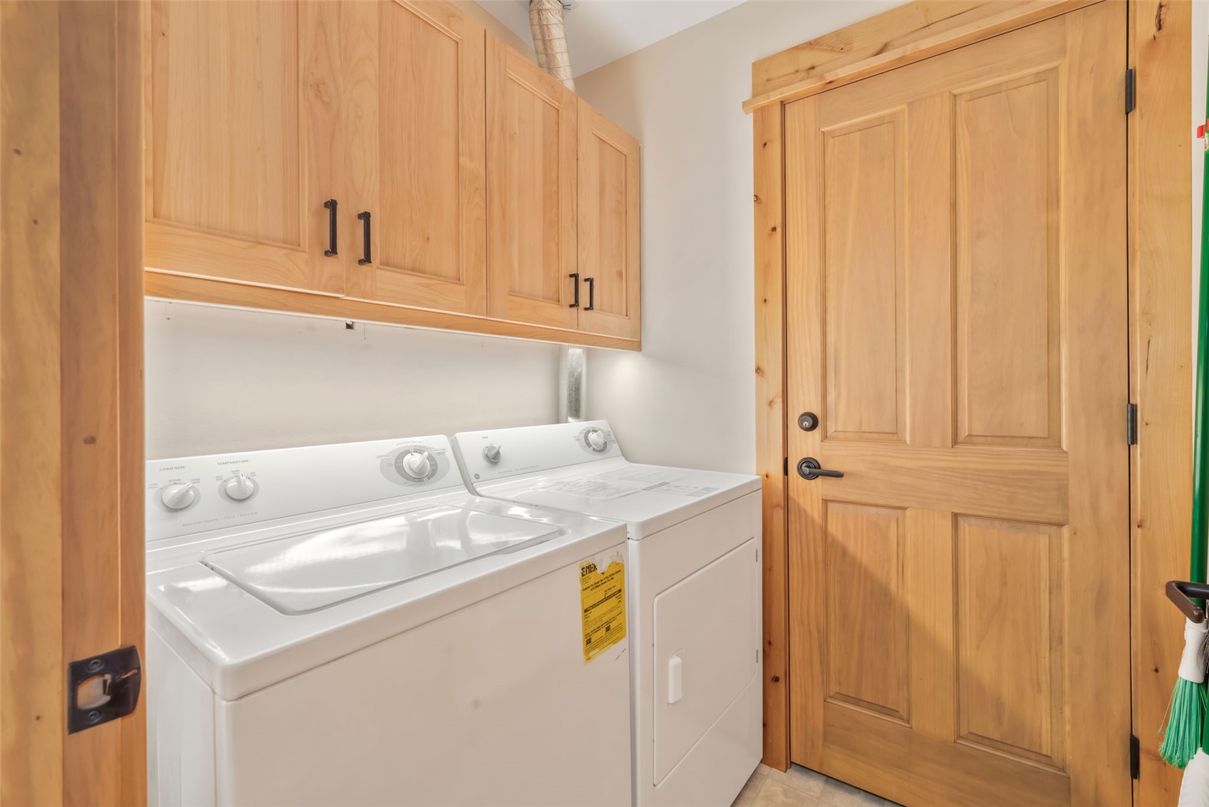 2720 Eagle Ridge Drive, Unit 207 Steamboat Springs, CO 80487 - Photo 15 of 37 a utility room with dryer and washer