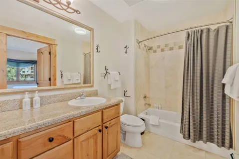 a bedroom with two beds and a window