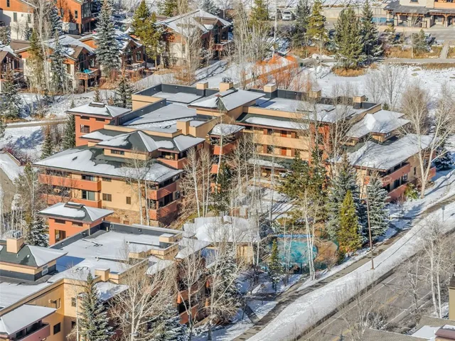 a view of a room with gym equipment and a large window