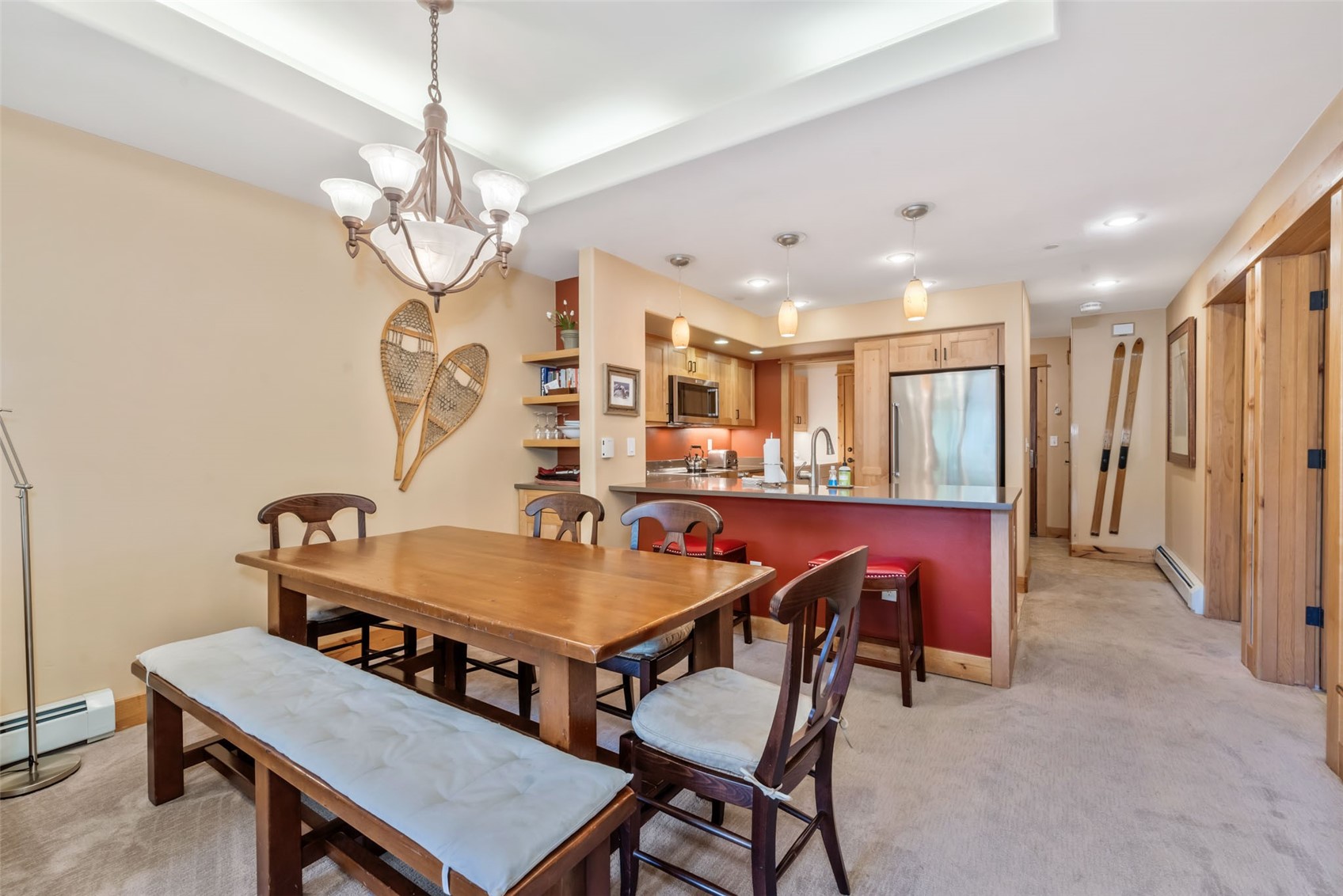 2720 Eagle Ridge Drive, Unit 207 Steamboat Springs, CO 80487 - Photo 5 of 37 a view of a dining room with furniture and a chandelier