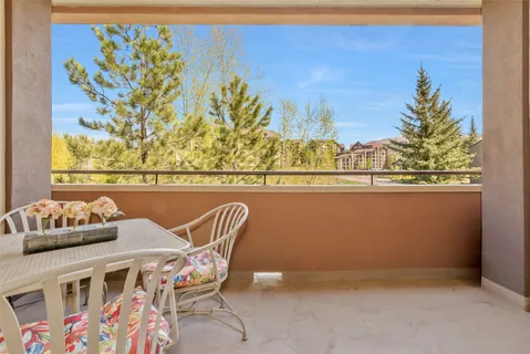 a view of swimming pool from a balcony