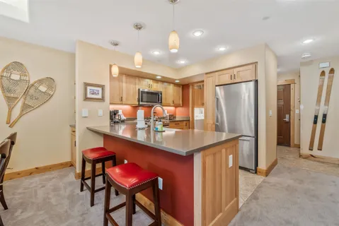 a kitchen with stainless steel appliances granite countertop a stove and a sink