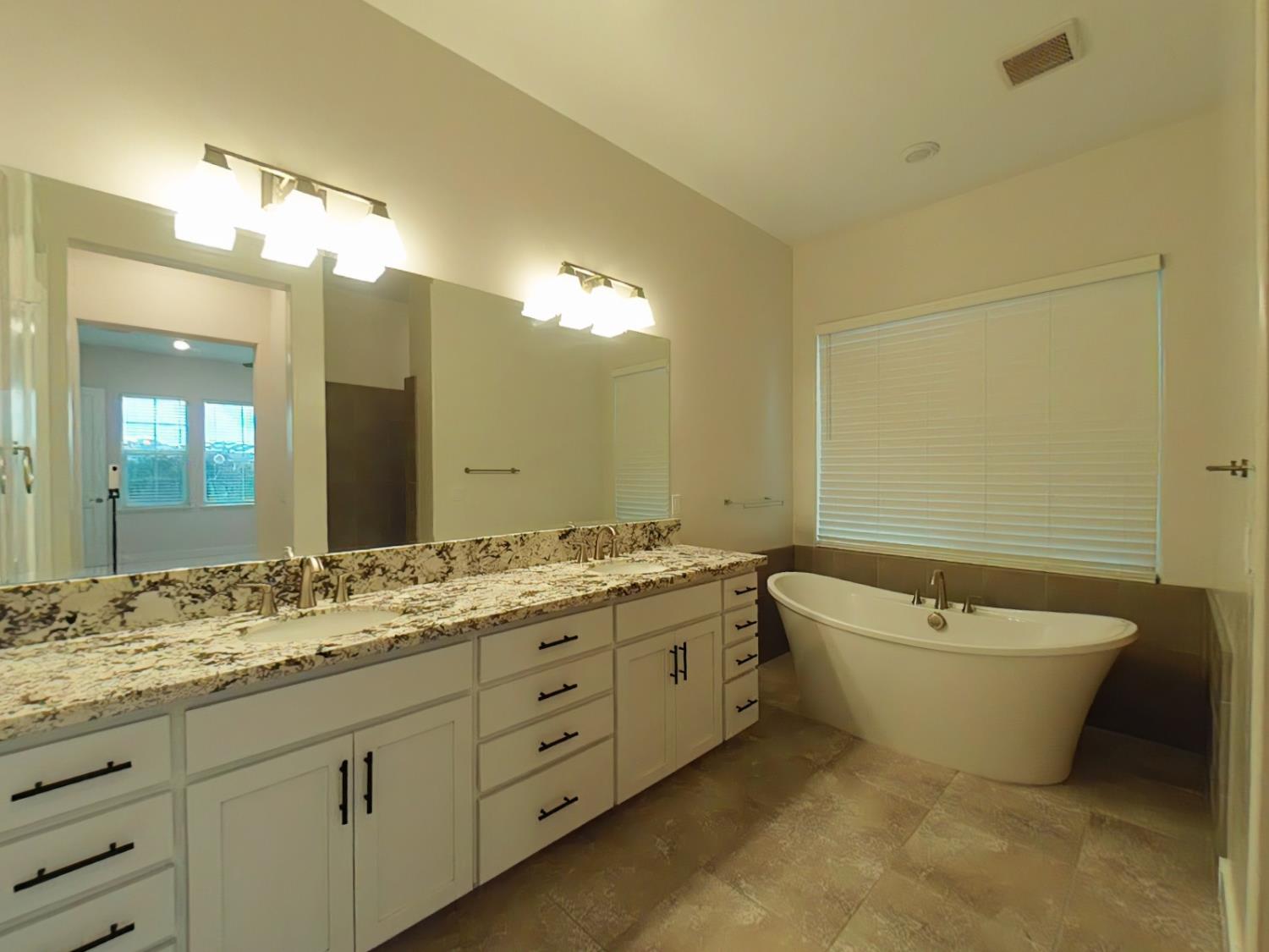 1236 Buck Ridge Rocklin, CA 95765 - Photo 26 of 66 a bathroom with a granite countertop sink and a bathtub