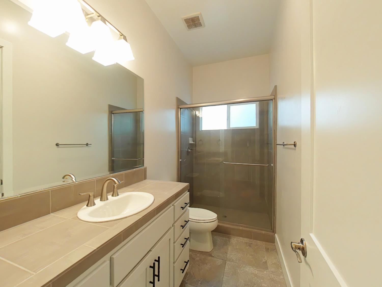 1236 Buck Ridge Rocklin, CA 95765 - Photo 32 of 66 a bathroom with a sink toilet and shower