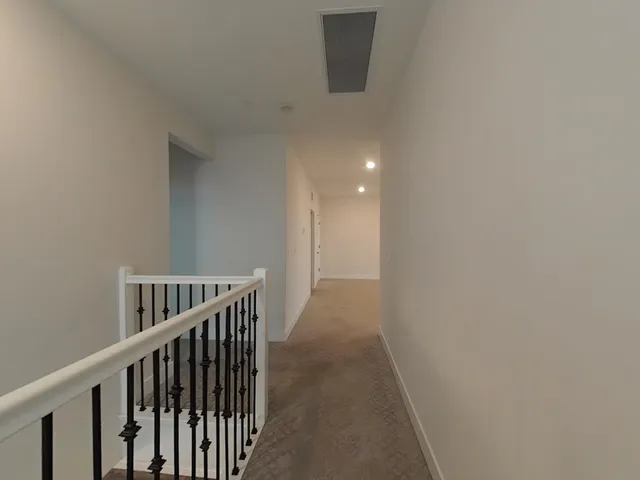 an empty room with a empty space and a window