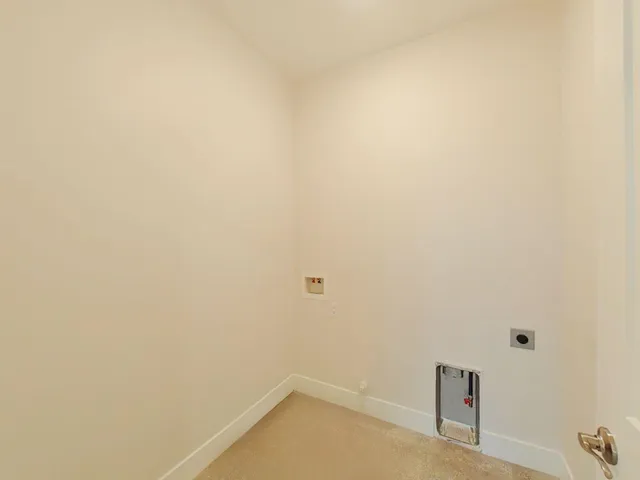 a view of a livingroom with a ceiling fan and window
