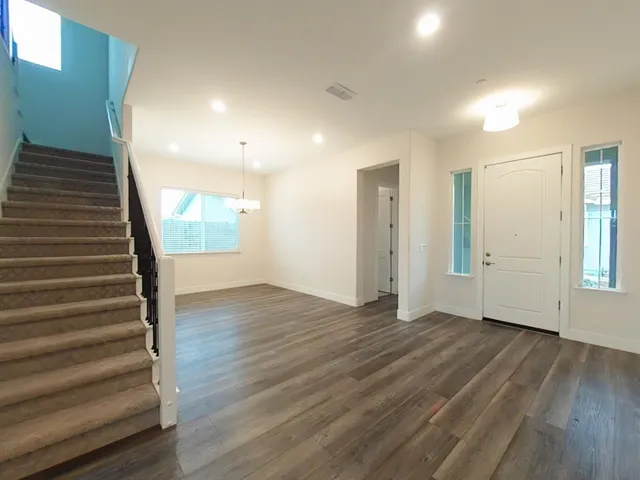 a kitchen with stainless steel appliances granite countertop a stove and a sink