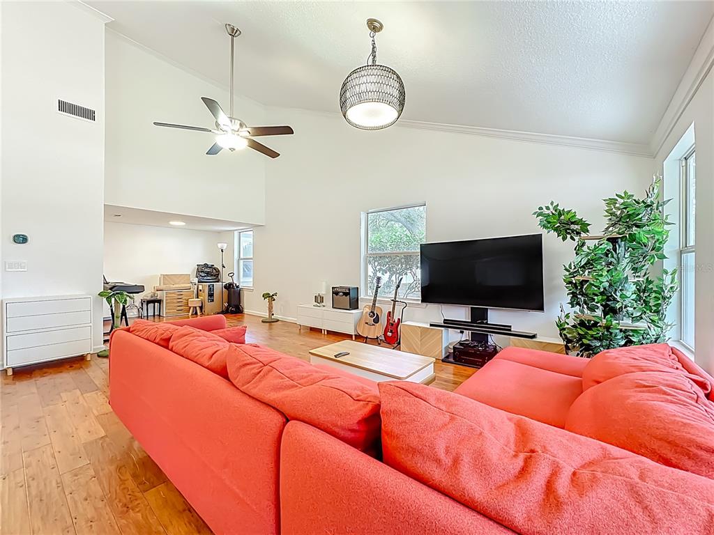 6380 Bahaia Road Fleming Island, FL 32003 - Photo 11 of 77 a bedroom with a bed and a flat screen tv