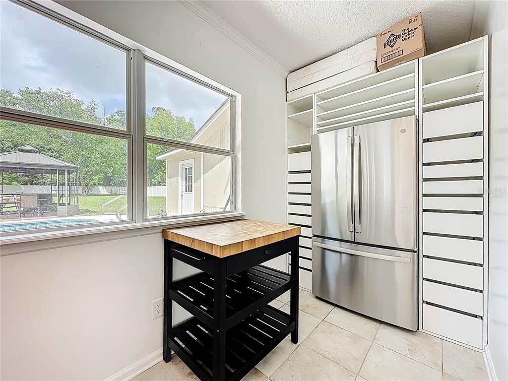 6380 Bahaia Road Fleming Island, FL 32003 - Photo 19 of 77 a kitchen with stainless steel appliances granite countertop a refrigerator and a sink