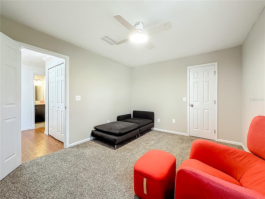 6380 Bahaia Road Fleming Island, FL 32003 - Photo 33 of 77 a living room with furniture and wooden floor