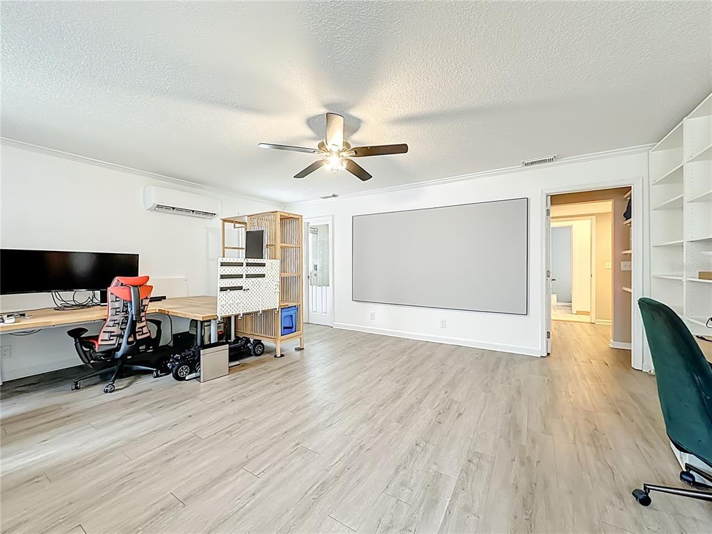 6380 Bahaia Road Fleming Island, FL 32003 - Photo 39 of 77 a living room with furniture and a flat screen tv