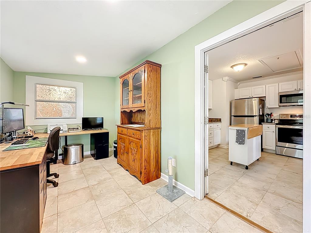 6380 Bahaia Road Fleming Island, FL 32003 - Photo 45 of 77 a open kitchen with cabinets and stainless steel appliances