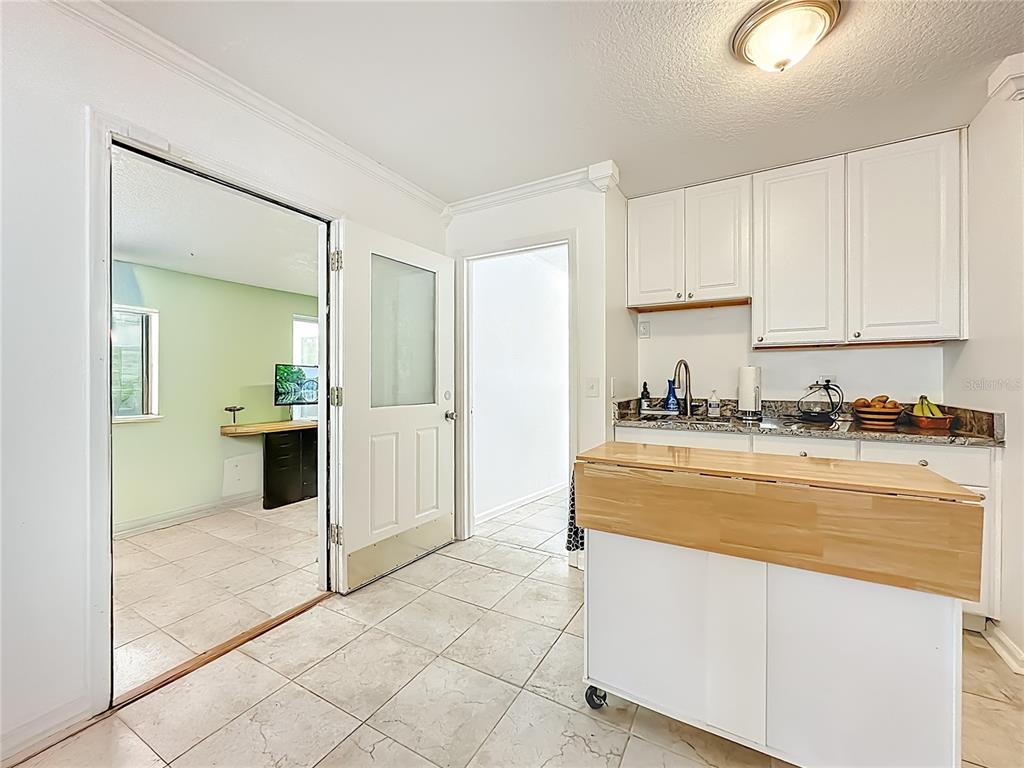 6380 Bahaia Road Fleming Island, FL 32003 - Photo 46 of 77 a view of kitchen with stainless steel appliances granite countertop a refrigerator and a stove top oven