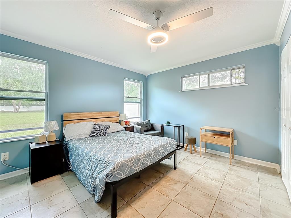 6380 Bahaia Road Fleming Island, FL 32003 - Photo 51 of 77 a bedroom with a bed and a window