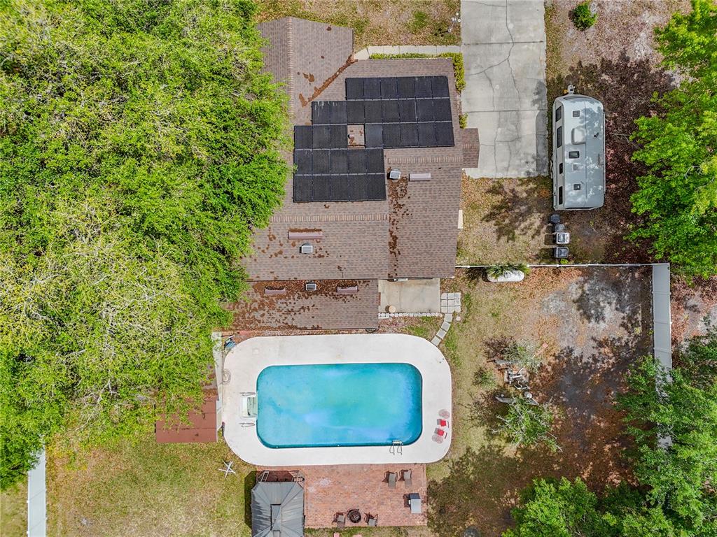 6380 Bahaia Road Fleming Island, FL 32003 - Photo 66 of 77 an aerial view of a house with a yard and trees all around