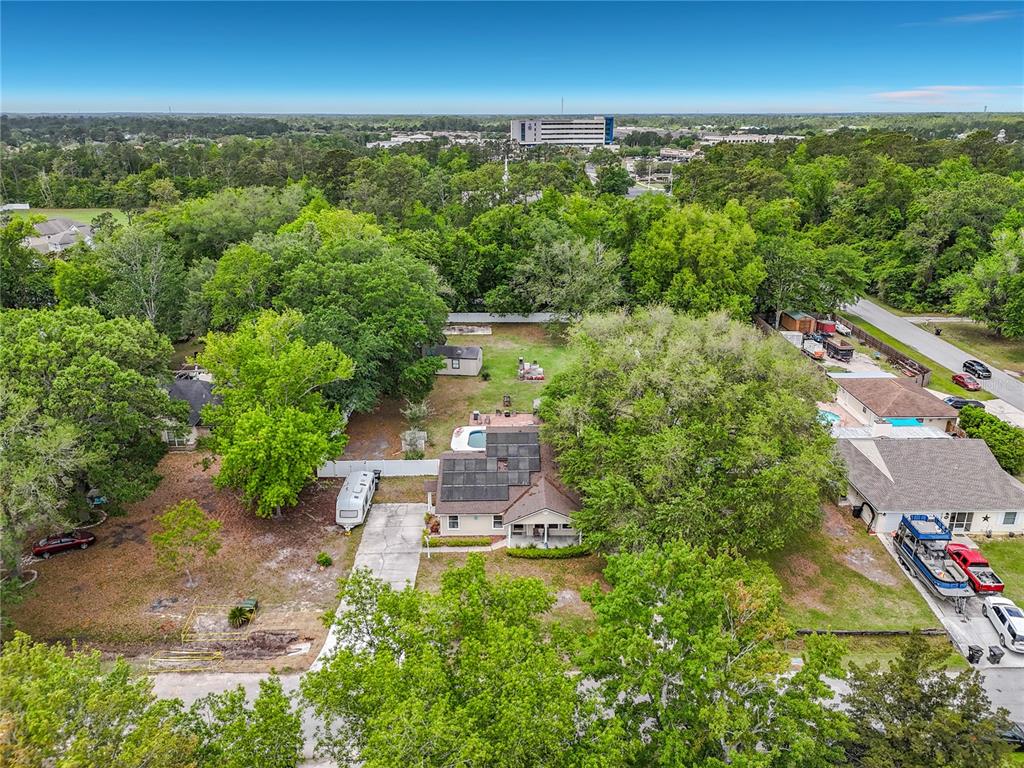 6380 Bahaia Road Fleming Island, FL 32003 - Photo 74 of 77 an aerial view of a residential houses with outdoor space and trees all around