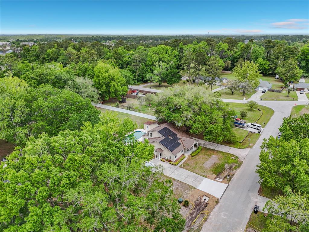 6380 Bahaia Road Fleming Island, FL 32003 - Photo 77 of 77 an aerial view of residential houses with outdoor space and trees