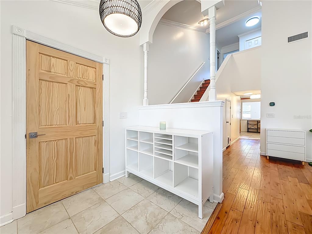 6380 Bahaia Road Fleming Island, FL 32003 - Photo 8 of 77 a view of a livingroom with furniture and wooden floor