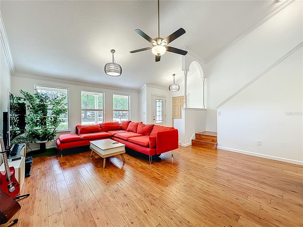 6380 Bahaia Road Fleming Island, FL 32003 - Photo 10 of 77 a bedroom with furniture and wooden floor