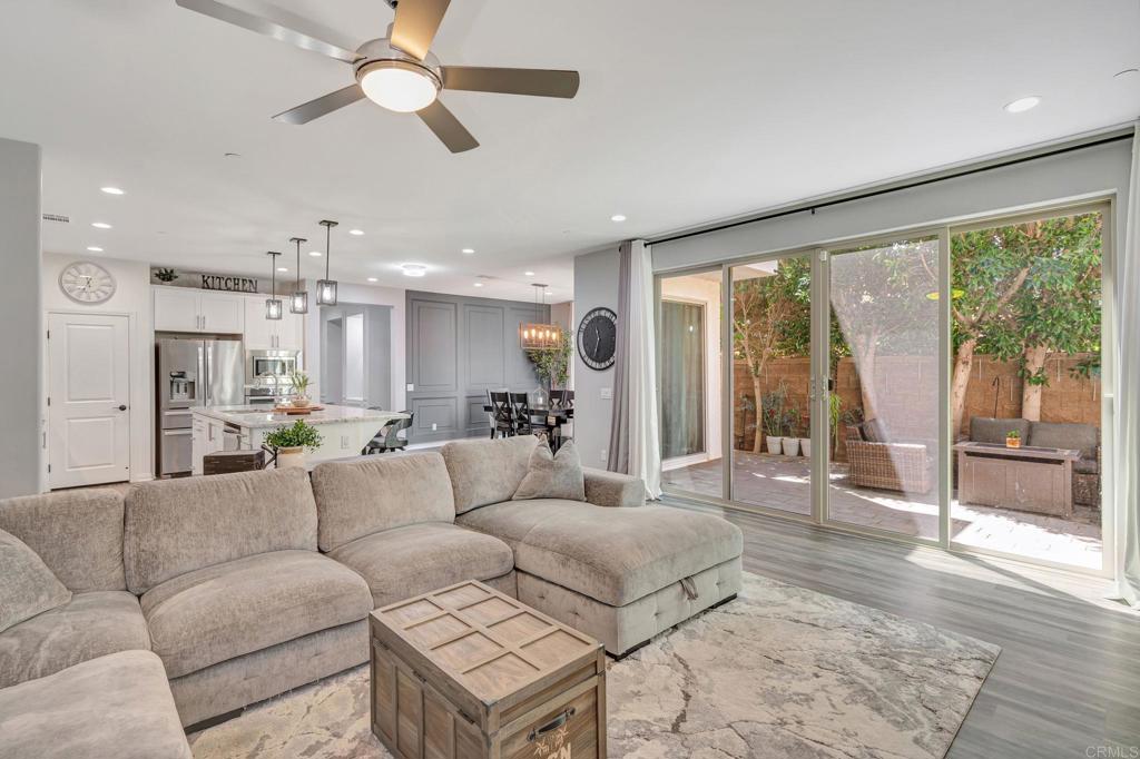21408 Trail Ridge Drive Escondido, CA 92029 - Photo 13 of 50 a living room with furniture and a large window with kitchen view