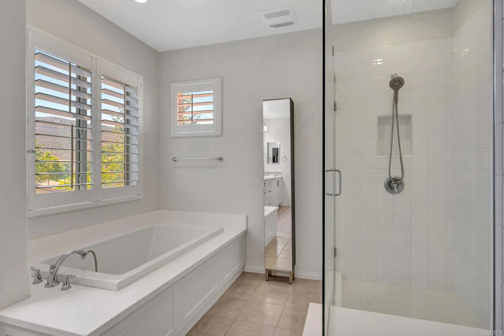 21408 Trail Ridge Drive Escondido, CA 92029 - Photo 23 of 50 a bathroom with a tub sink and shower