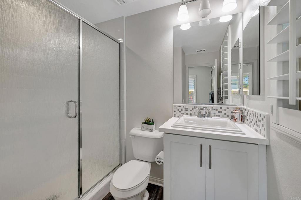 21408 Trail Ridge Drive Escondido, CA 92029 - Photo 26 of 50 a bathroom with a sink toilet and shower