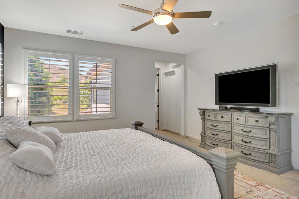 21408 Trail Ridge Drive Escondido, CA 92029 - Photo 27 of 50 a bedroom with a bed and a flat screen tv
