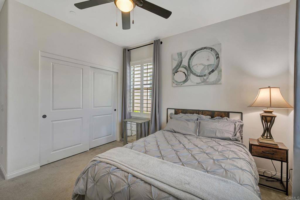 21408 Trail Ridge Drive Escondido, CA 92029 - Photo 29 of 50 a bedroom with a bed and a chandelier