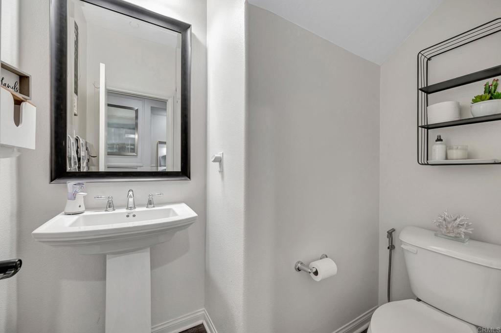 21408 Trail Ridge Drive Escondido, CA 92029 - Photo 30 of 50 a bathroom with a toilet sink and mirror