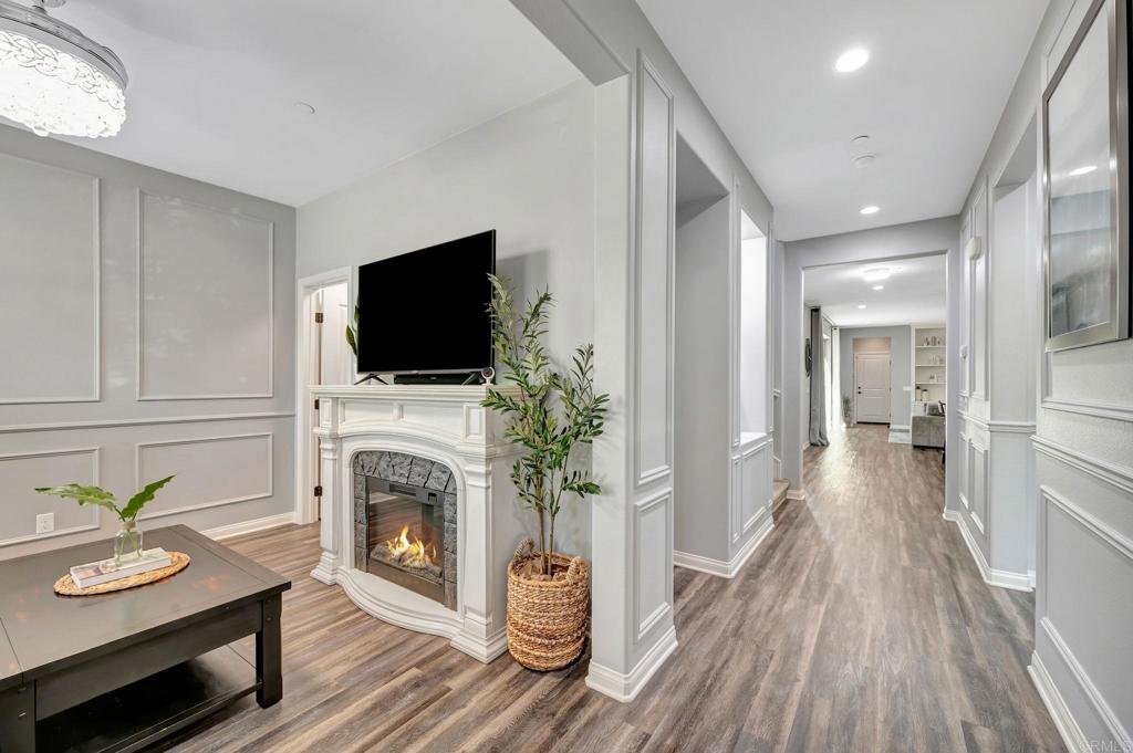 21408 Trail Ridge Drive Escondido, CA 92029 - Photo 3 of 50 a living room with furniture a flat screen tv and a fireplace
