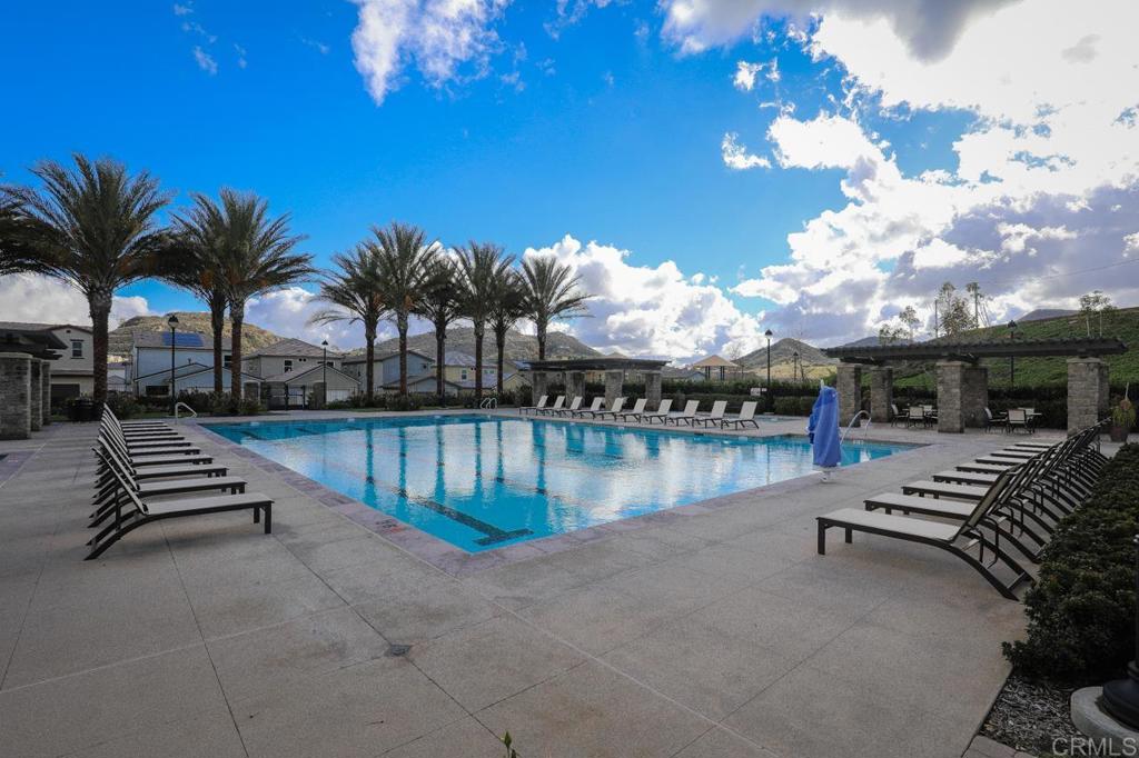 21408 Trail Ridge Drive Escondido, CA 92029 - Photo 46 of 50 a view of swimming pool with outdoor seating and lake view