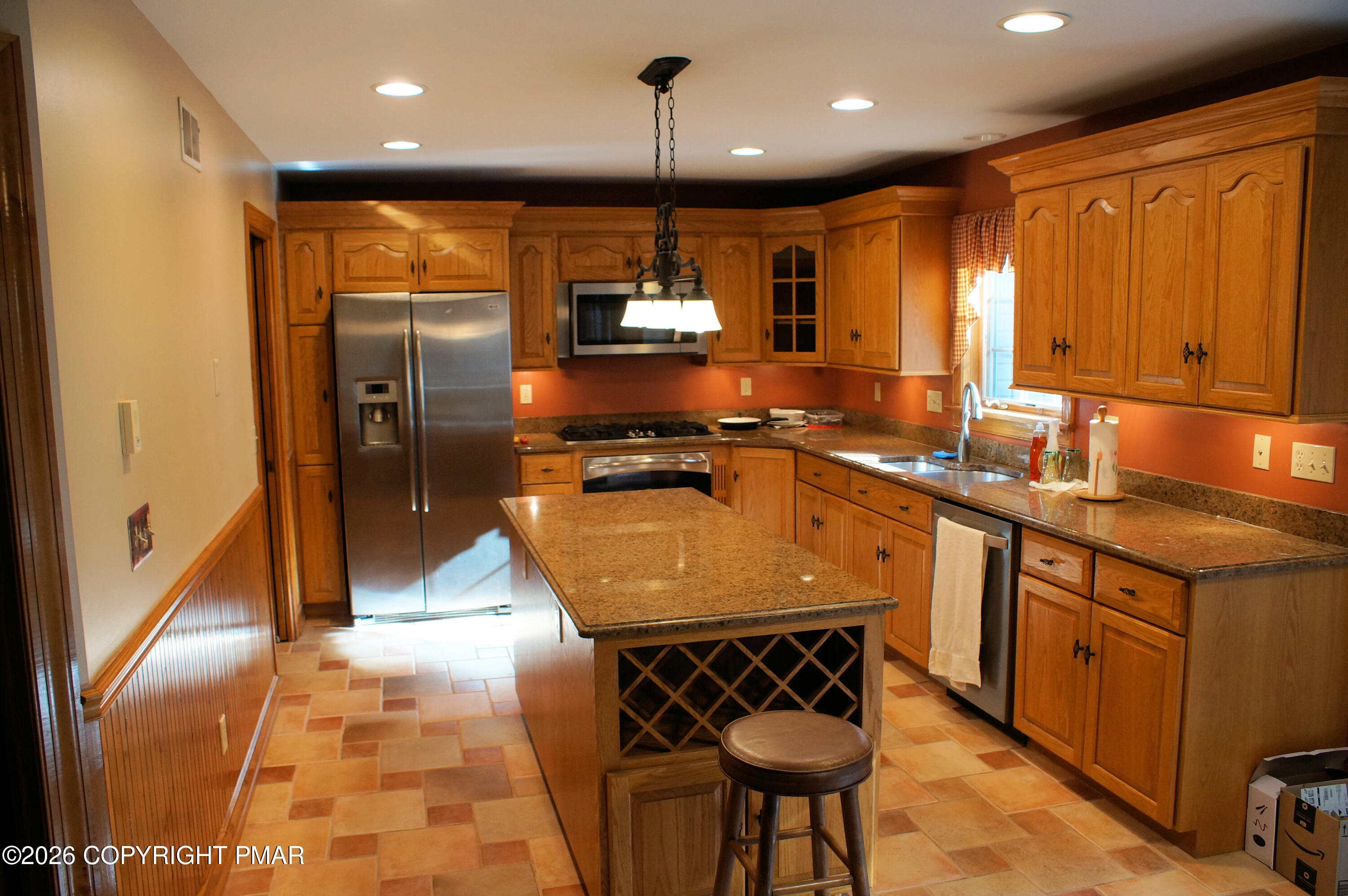 272 White Church Road Saylorsburg, PA 18353 - Photo 4 of 6 a kitchen with stainless steel appliances granite countertop a sink a stove and a refrigerator