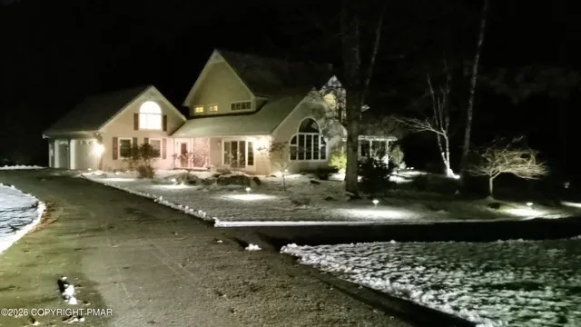 a view of a water fountain in front of house