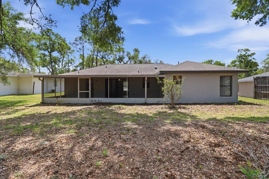 6355 East Rush Street Inverness, FL 34452 - Photo 22 of 27 a front view of a house with a garden