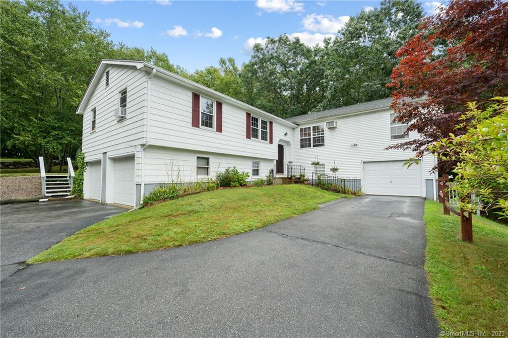 292 Cow Hill Road Groton, CT 06355 - Photo 1 of 1 a front view of house with yard and green space