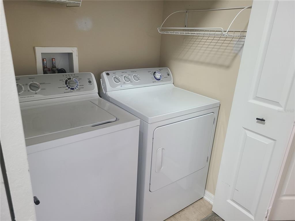 14956 Amberjack Terrace, Unit 103 Lakewood Ranch, FL 34202 - Photo 11 of 16 a utility room with dryer and washer