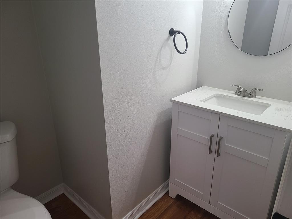 14956 Amberjack Terrace, Unit 103 Lakewood Ranch, FL 34202 - Photo 12 of 16 a bathroom with a sink and mirror