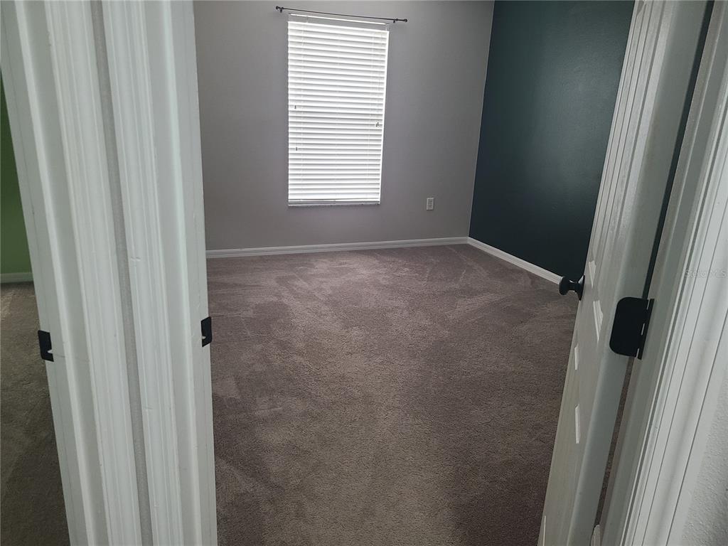 14956 Amberjack Terrace, Unit 103 Lakewood Ranch, FL 34202 - Photo 14 of 16 a view of an empty room with a window