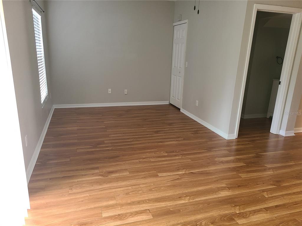 14956 Amberjack Terrace, Unit 103 Lakewood Ranch, FL 34202 - Photo 7 of 16 a view of a room with wooden floor