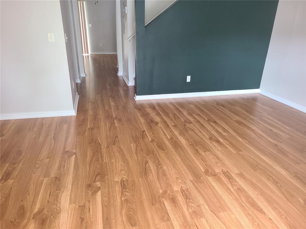 14956 Amberjack Terrace, Unit 103 Lakewood Ranch, FL 34202 - Photo 8 of 16 a view of a room with wooden floor