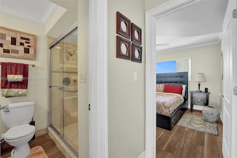 a bathroom with a shower and a sink