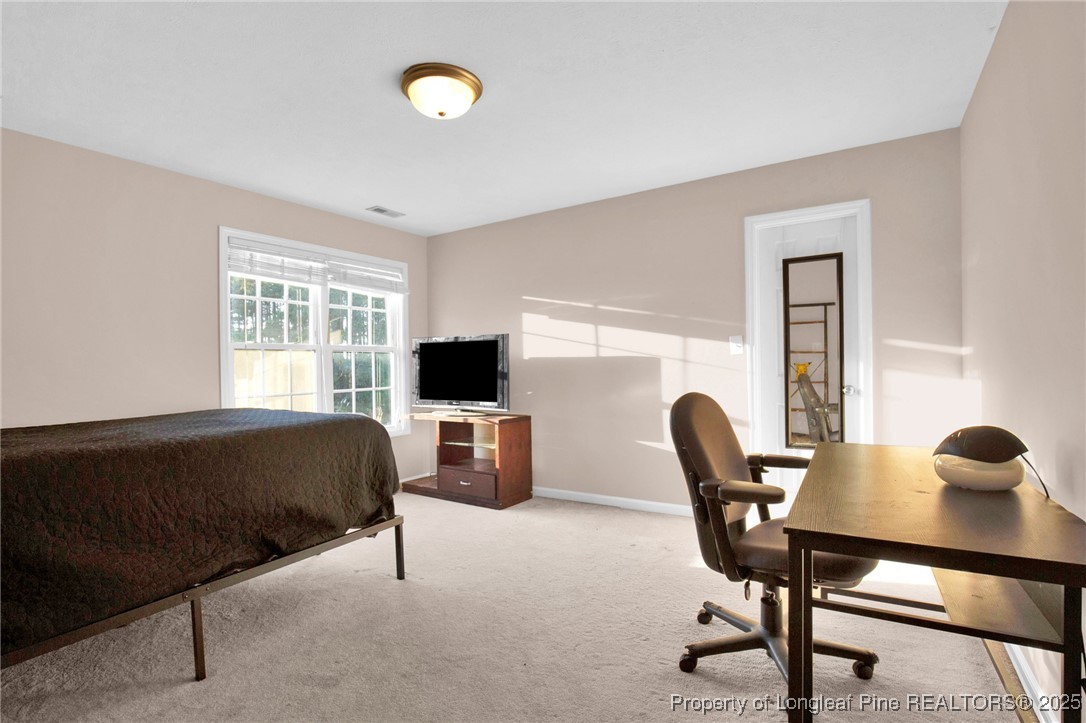 5650 Murphy Road Stedman, NC 28391 - Photo 27 of 36 a living room with furniture and a window