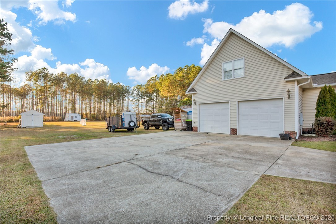 5650 Murphy Road Stedman, NC 28391 - Photo 30 of 36 a view of parking space with city view