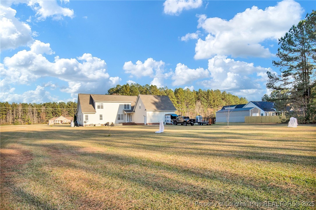 5650 Murphy Road Stedman, NC 28391 - Photo 32 of 36 a view of a house with a yard