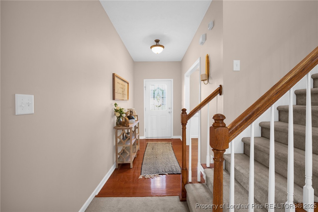 5650 Murphy Road Stedman, NC 28391 - Photo 4 of 36 a view of entryway and hall with wooden floor