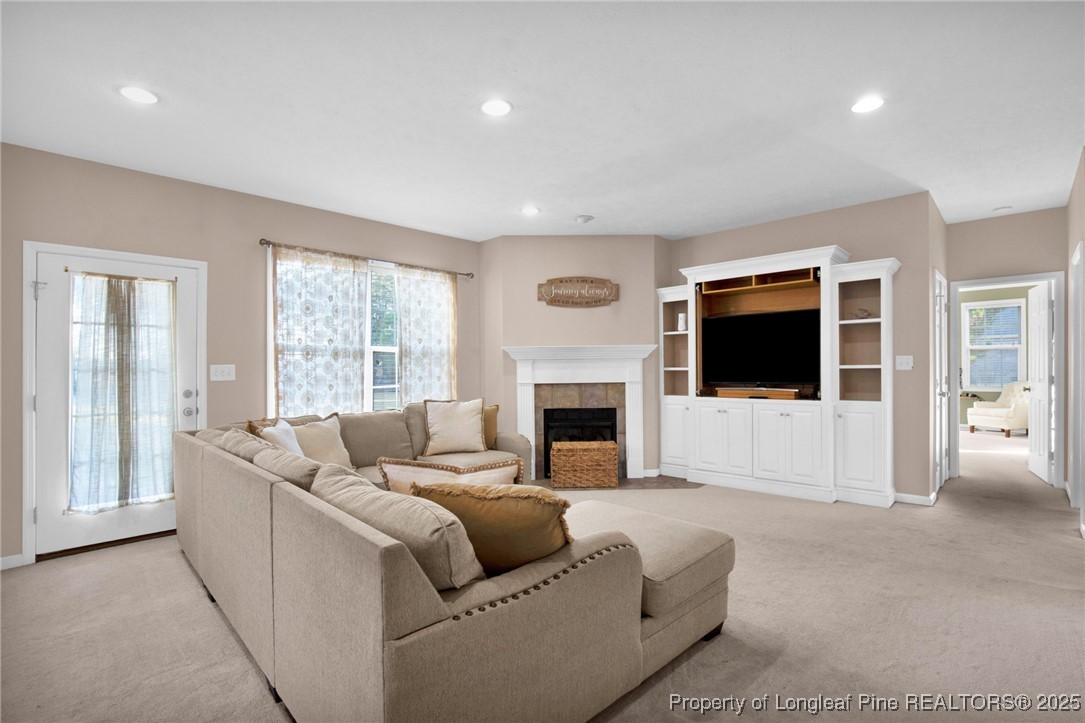 5650 Murphy Road Stedman, NC 28391 - Photo 7 of 36 a living room with furniture and a fireplace