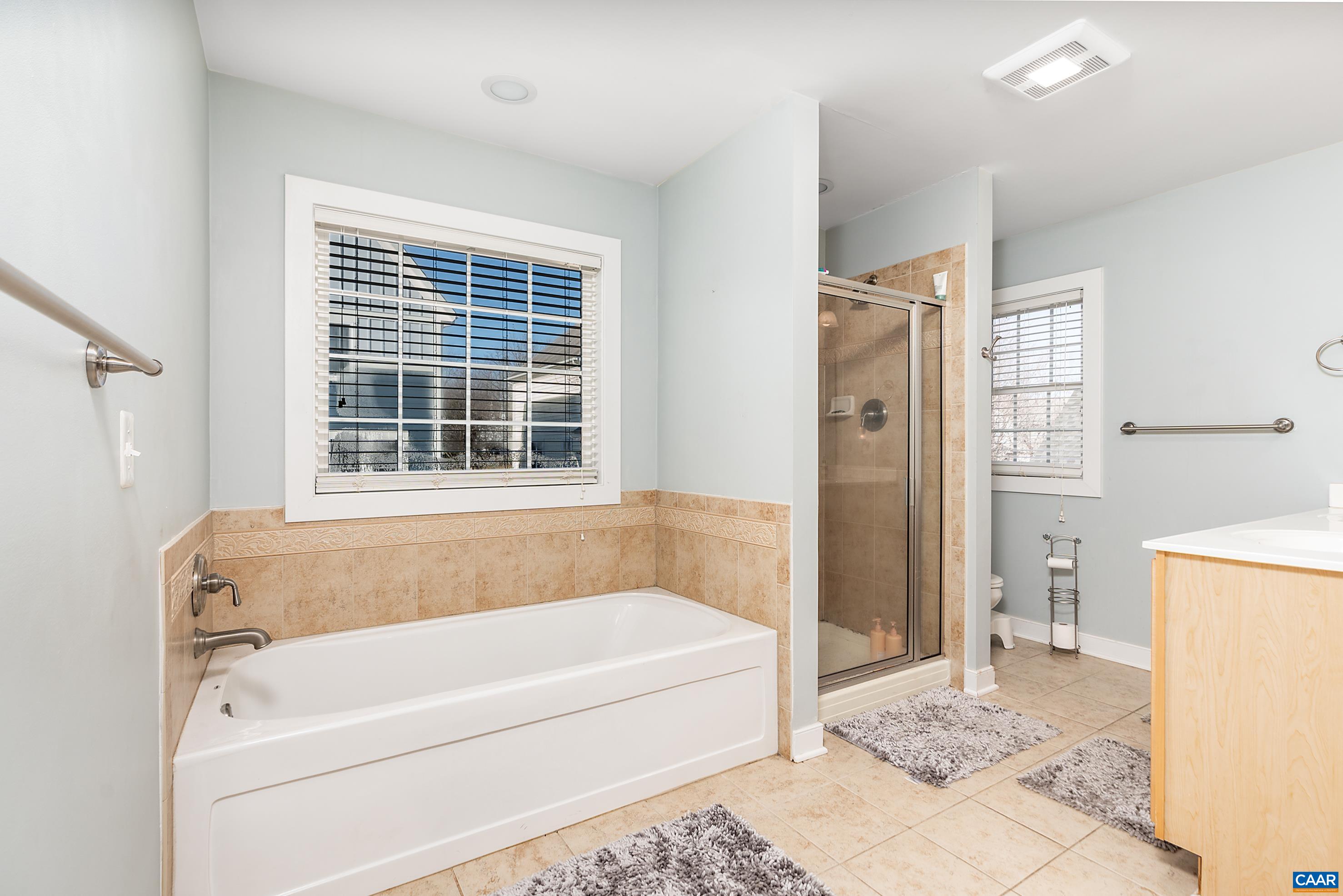 5478 Park Road Crozet, VA 22932 - Photo 13 of 24 a bathroom with a bathtub and a shower
