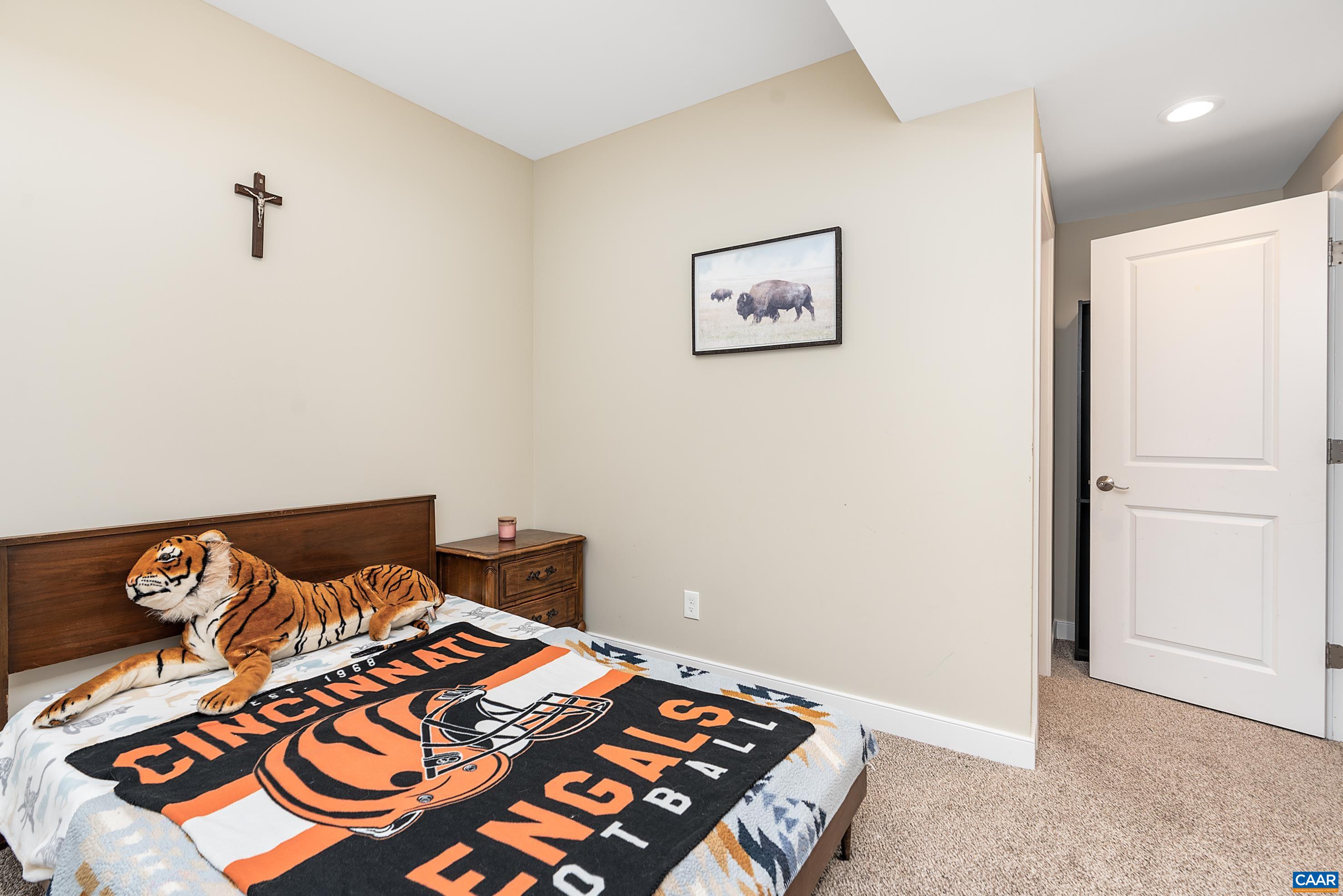 5478 Park Road Crozet, VA 22932 - Photo 20 of 24 a bedroom with a bed and a lamp on the dresser