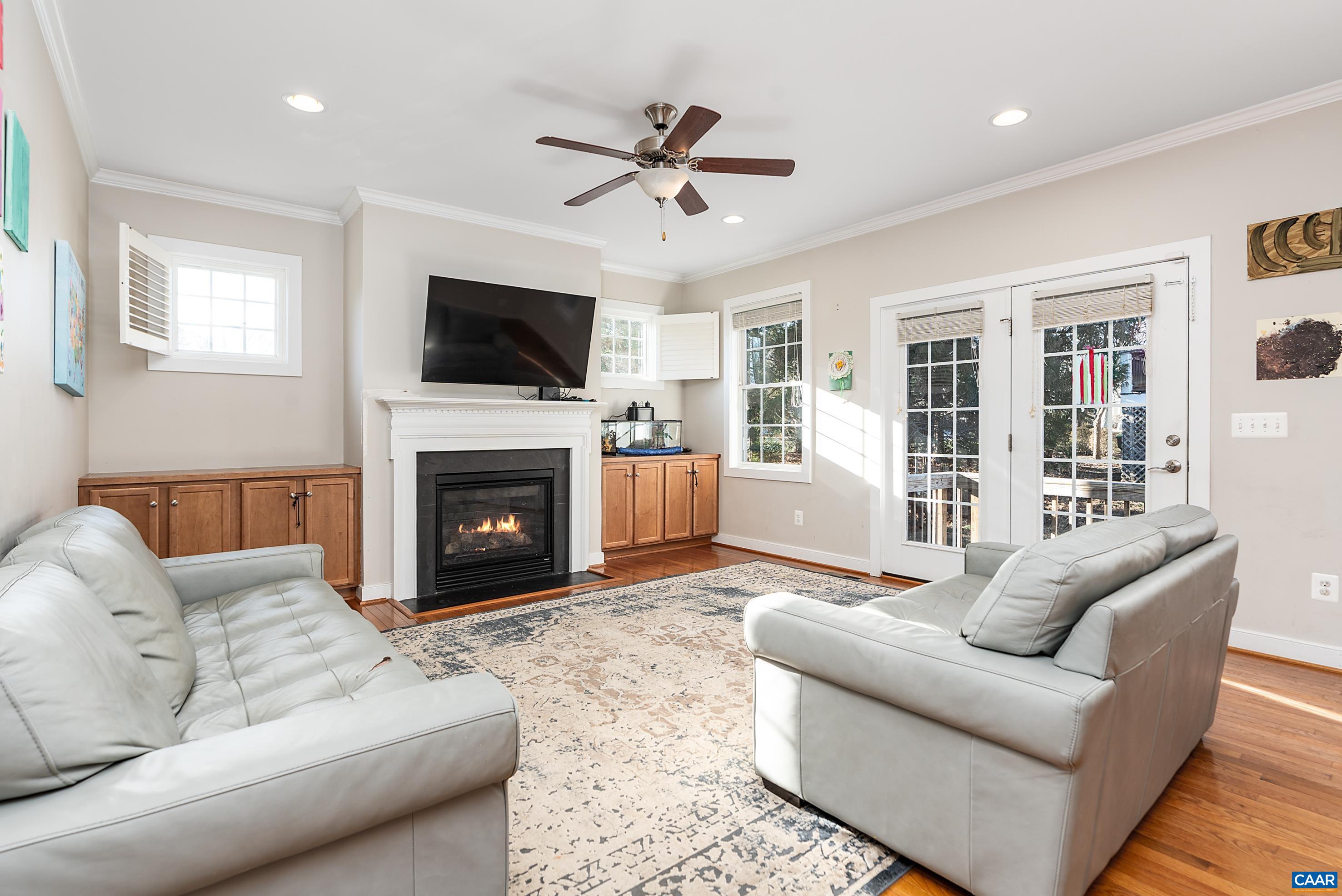 5478 Park Road Crozet, VA 22932 - Photo 3 of 24 a living room with furniture a flat screen tv and a fireplace