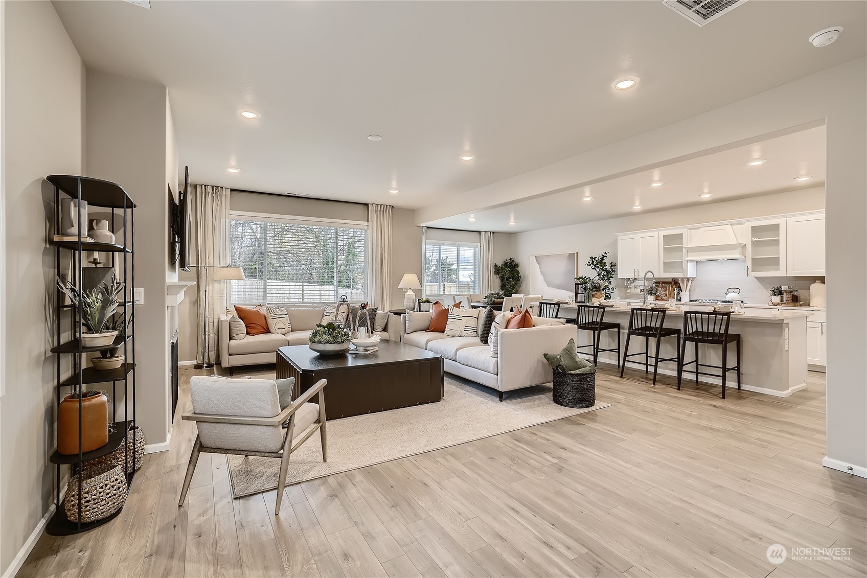 21120 42nd Drive Southeast, Unit 124 Bothell, WA 98021 - Photo 12 of 23 a living room with furniture and wooden floor